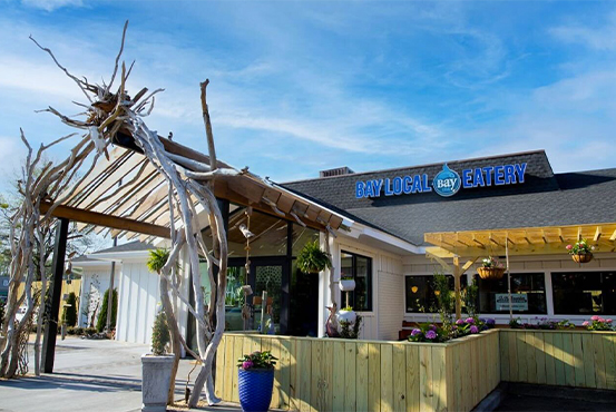 Bay Local logo on wood wall  